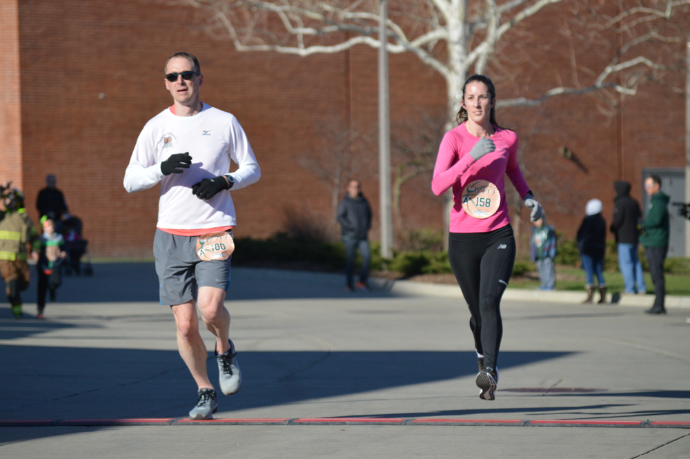 Dr. Cait Cavanagh crossing the finish line - finishing 2nd place in her age group